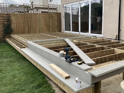 Decking flowing outside bifold doors 