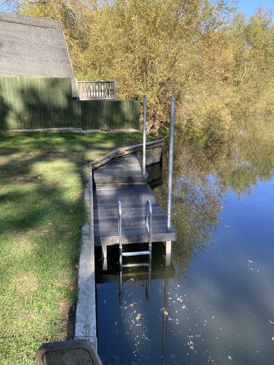 Landing stage with swim ladder