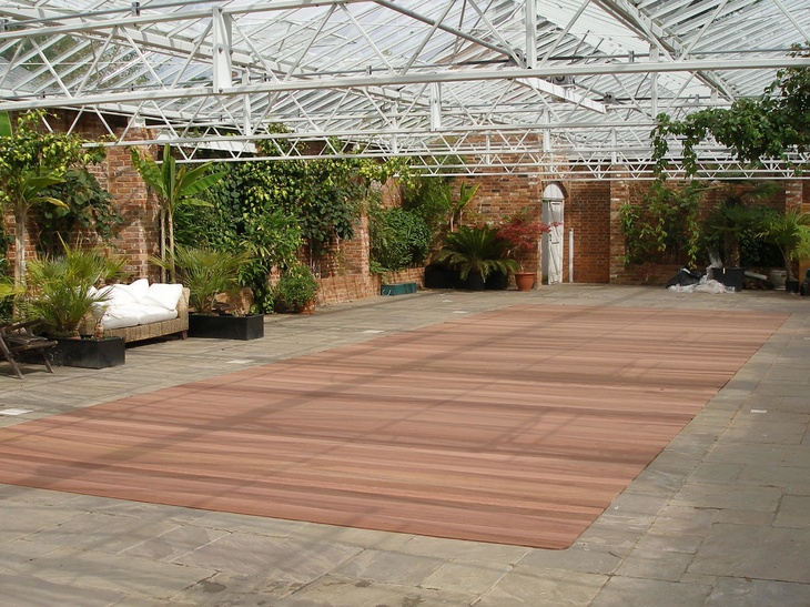 A hardwood swimming pool cover